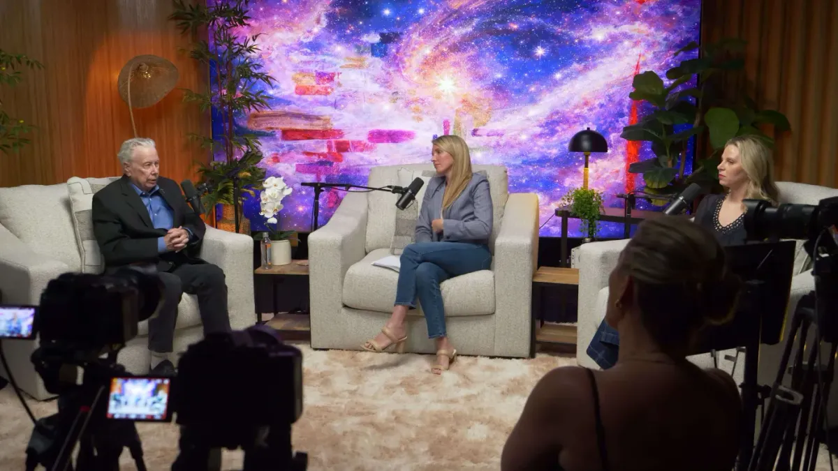 Wide-angle three-host interview at The Lounge with galaxy LED wall backdrop Las Vegas