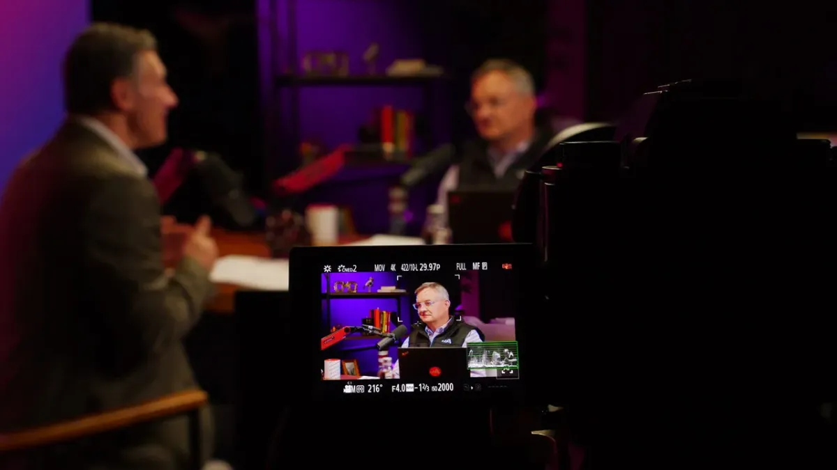Professional 4K camera filming podcast hosts at The Roundtable studio Las Vegas