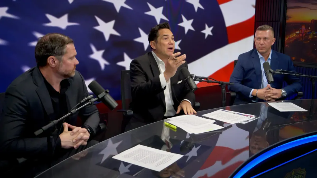 Three-host panel discussion at Studio 5 with American flag LED wall Sin City Podcast Studios Las Vegas